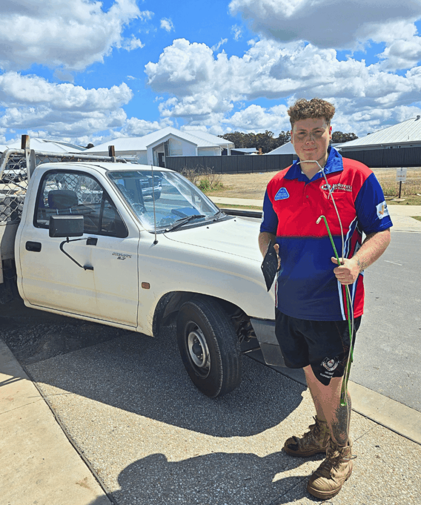Morayfield Locksmiths technician beside a ute, preparing to gain entry after the keys were locked inside in Moreton Bay