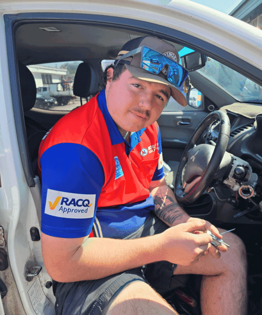 Morayfield Locksmiths technician reprogramming a car key fob from the driver’s seat of a ute on-site